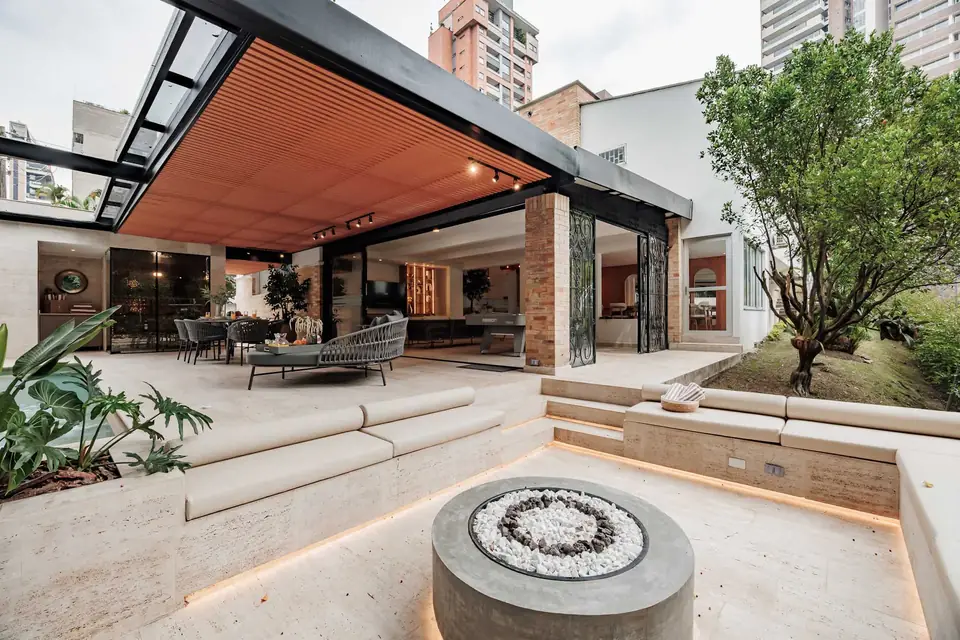 Large outdoor dining and pool area at a group villa in Medellín