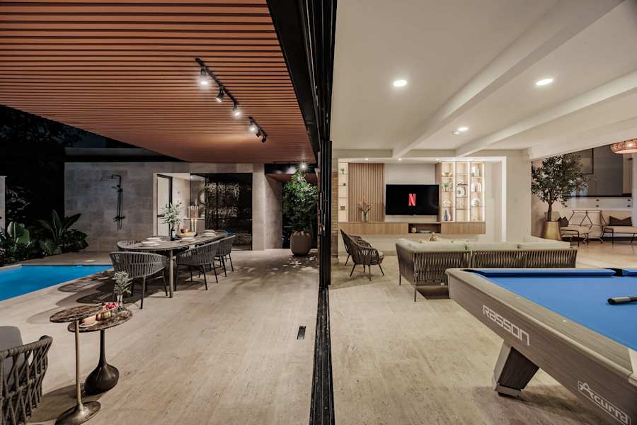 Indoor–outdoor social lounge by the pool