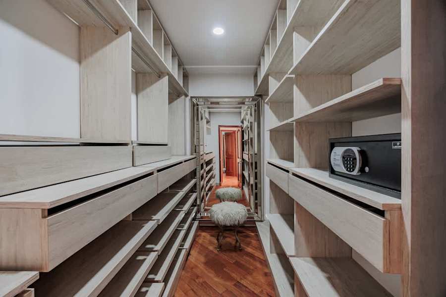 Primary Suite – Spacious walk-in wardrobe with generous storage.