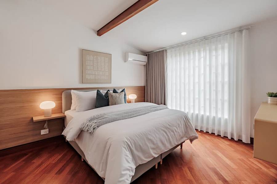 Private Suite #2: Elegant Functionality. Seamlessly blending entertainment and privacy. Enjoy high-end finishes, a floating artisanal vanity, and a wall-mounted Smart TV, all steps away from your modern, pristine ensuite bathroom.
