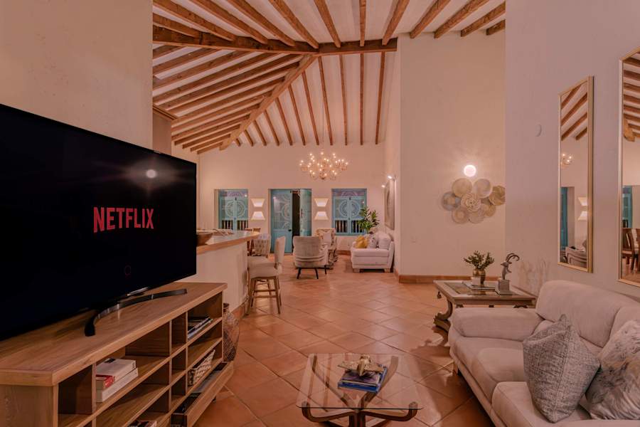 Cozy living area with Smart TV and beamed ceiling