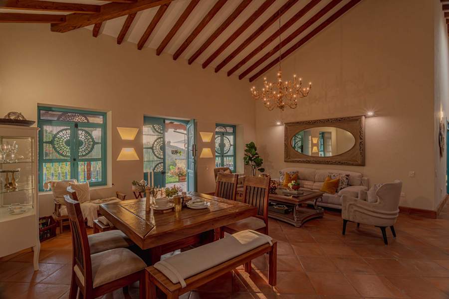 Warm open dining and living room with colonial windows