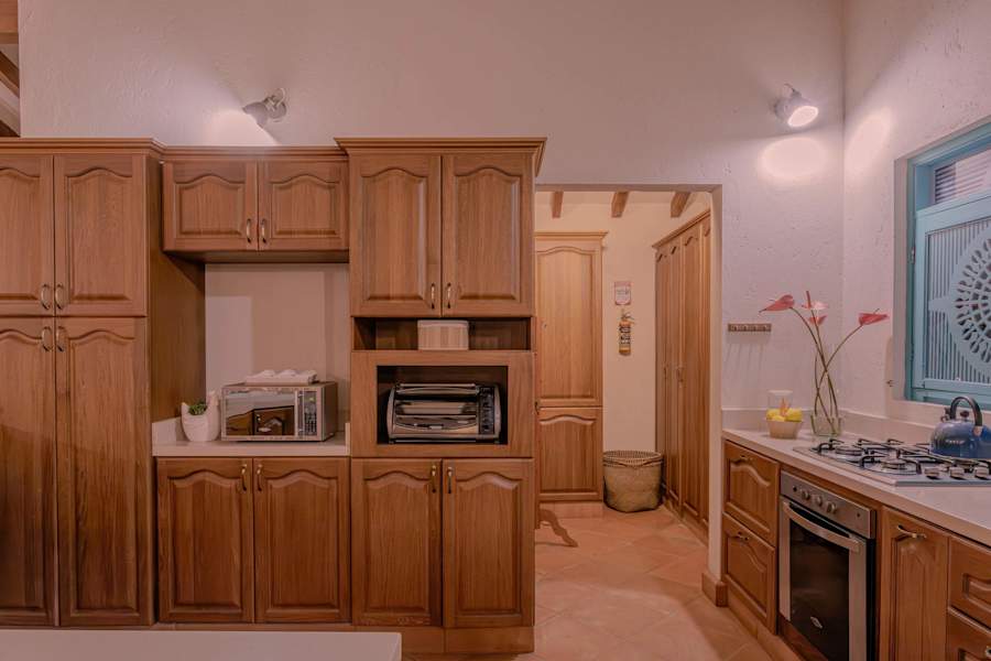 Fully equipped kitchen with fridge and microwave